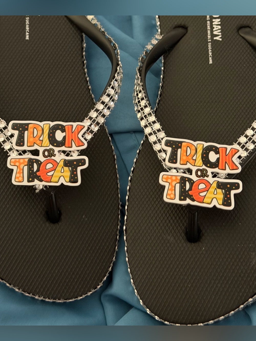 Trick or Treat' Black Jelly Flip Flops with Gem Accents